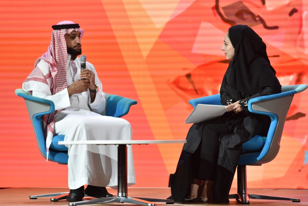 First Saudi female Olympic fencer Lobna Al-Omair speaks with British professional boxer Amir Khan on the panel “What defines me”. Amir attended the session wearing the traditional Saudi attire. — SG
