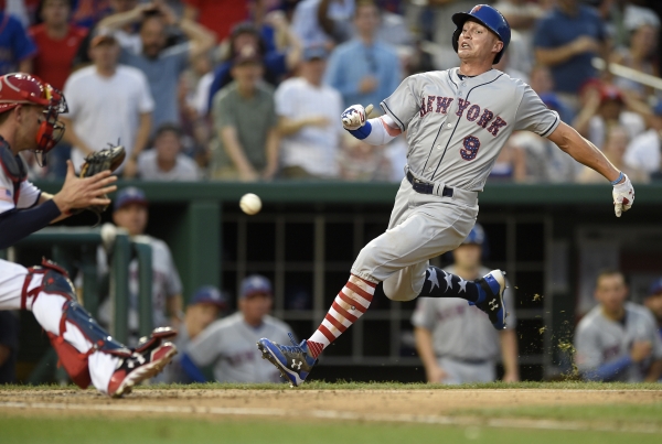 New York Mets' Brandon Nimmo (9) runs towards home against Washington Nationals catcher Matt Wieters, left, during the eighth inning of a baseball game, Monday in Washington. Nimmo was out at home on the play. The Nationals won 3-2. — AP