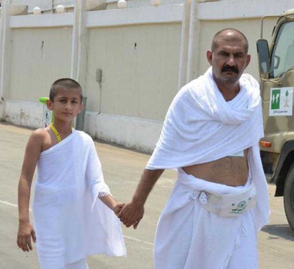 Pilgrims ascend to Mina at the start of the Haj rituals