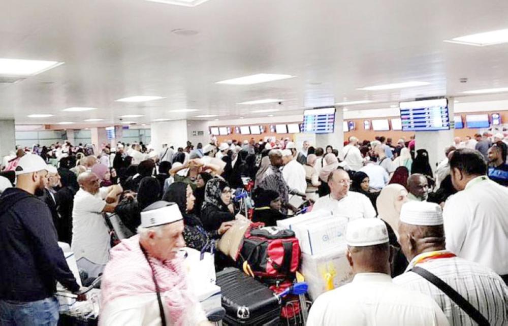 Home-bound Haj pilgrims crowd Jeddah airport waiting for their departure flights