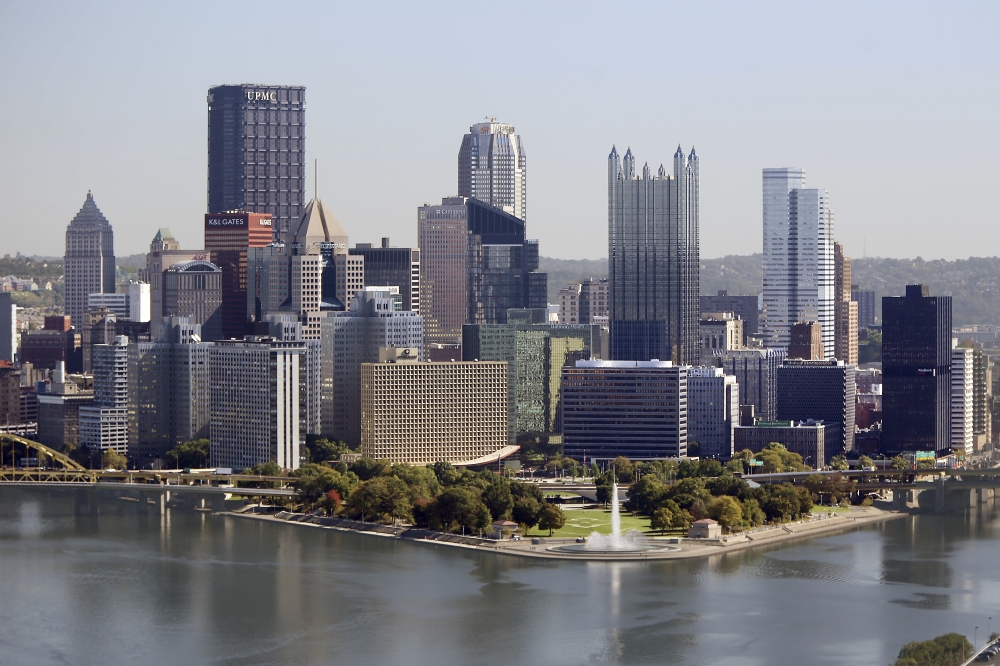 The Pittsburgh skyline is seen from the West End Overlook, a city park, Wednesday. Pittsburgh is one of dozens of cities working frantically to land Amazon's second headquarters. Amazon is promising $5 billion of investment and 50,000 jobs over the next decade and a half. Yet the winning city would have to provide Amazon with generous tax breaks and other incentives. — AP