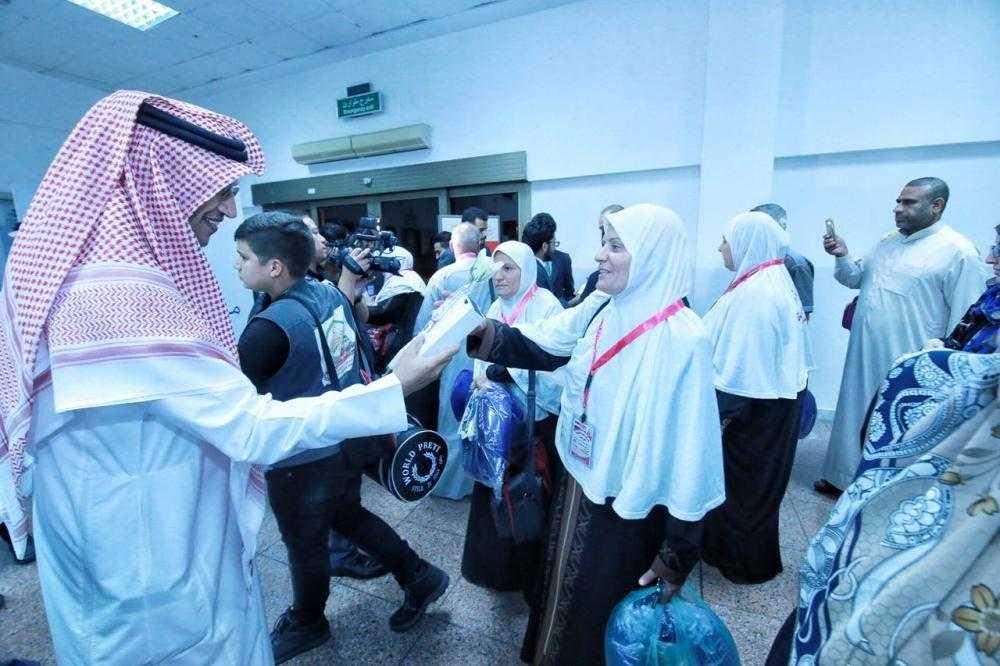 Officials receive the Iraqi Umrah pilgrims flown in by Saudi Arabian Airlines in 27 years at King Abdulaziz International Airport in Jeddah on Monday. — Courtesy Makkah