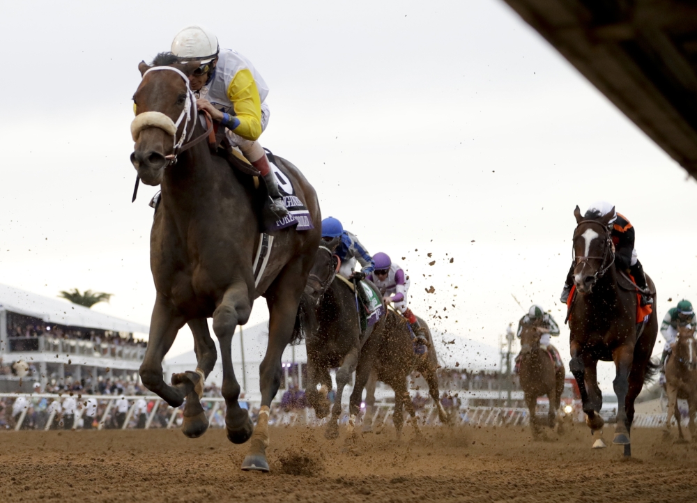 Forever Unbridled, left, with John R. Velazquez aboard, wins the Longines Distaff horse race during the first day of the Breeders' Cup, Friday in Del Mar, Calif. — AP