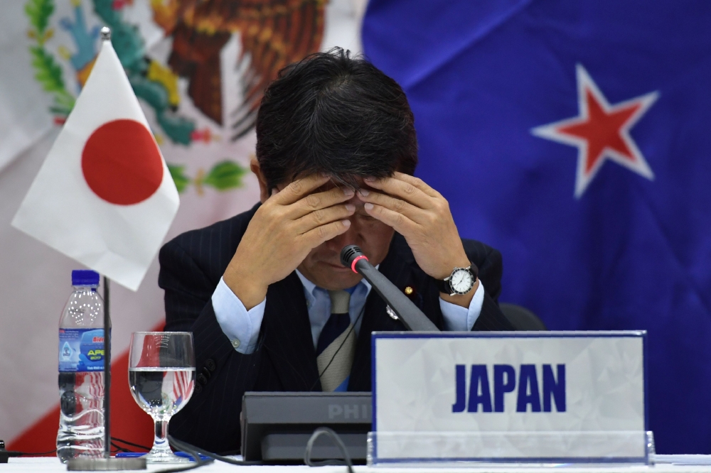 Japan’s Economic Revitalization Minister Toshimitsu Motegi reacts during a Trans Pacific Partnership (TPP) press conference on the sidelines of the Asia-Pacific Economic Cooperation (APEC) Summit in the central Vietnamese city of Danang on Saturday. — AFP