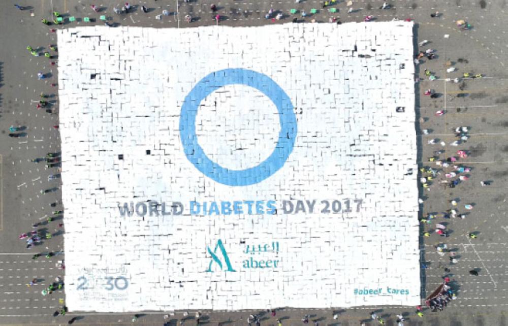 IISJ students, Abeer set Guinness record for largest human mosaic