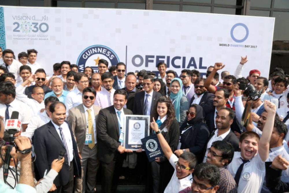 IISJ students, Abeer set Guinness record for largest human mosaic