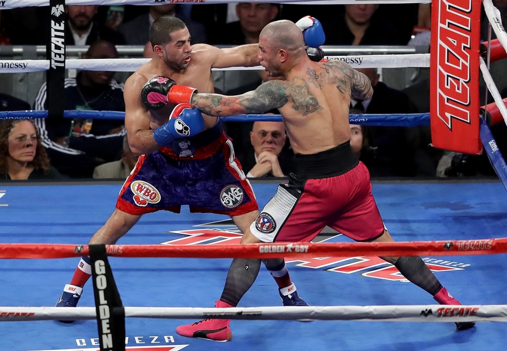 Miguel Cotto (R) and Sadaam Ali fight during their Junior Middleweight match at Madison Square Garden on Saturday in New York City. — AFP
