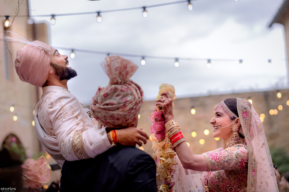 This handout picture released by Yash Raj Films shows Indian cricketer Virat Kohli and Bollywood actress Anushka Sharma during their wedding ceremony in Buoncovento near Siena, Italy on Monday. - AFP