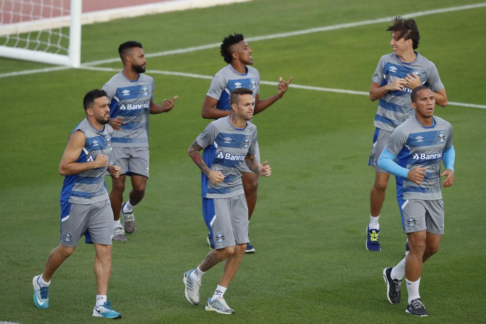Gremio players run during a training session in Abu Dhabi Thursday. — AP 