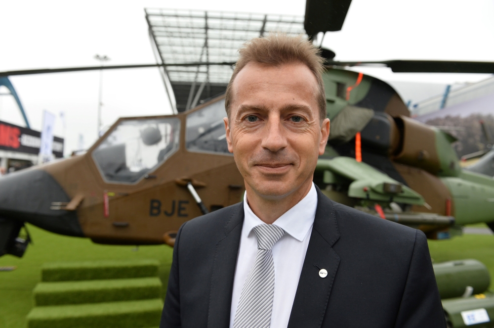 This file photo shows Airbus Helicopters CEO, Guillaume Faury posing for a picture in front of an Airbus Tiger military helicopter during the 23rd International Defense Industry Exhibition MSPO in Kielce, Poland. — AFP