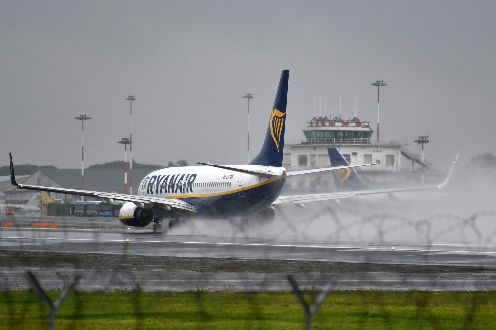A plane of Irish low-coast airline company Ryanair is pictured on the tarmac of Rome's Ciampino airport on Friday. Ryanair pilots in Italy are to suspend their planned strike action scheduled for later today after management of the Irish low-cost airline offered to recognize unions for the first time, unions said. — AFP