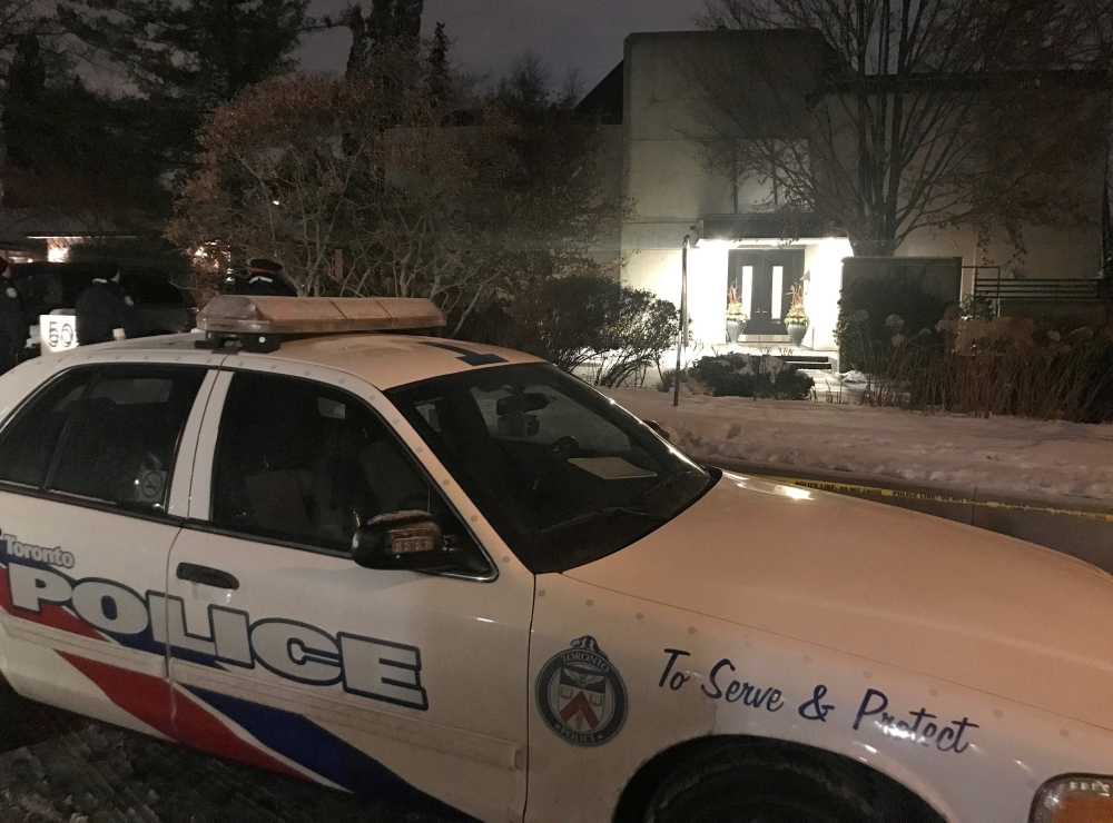 Police outside of the home of billionaire founder of Canadian pharmaceutical firm Apotex Inc., Barry Sherman and his wife Honey, who were found dead in their home under circumstances that police described as suspicious in Toronto, Canada, on Friday. — Reuters