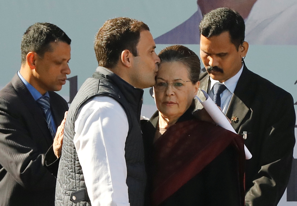 Rahul Gandhi, newly elected president of India’s main opposition Congress party, kisses the forehead of his mother and leader of the party Sonia Gandhi after taking charge as the president during a ceremony at the party’s headquarters in New Delhi on Saturday. — Reuters