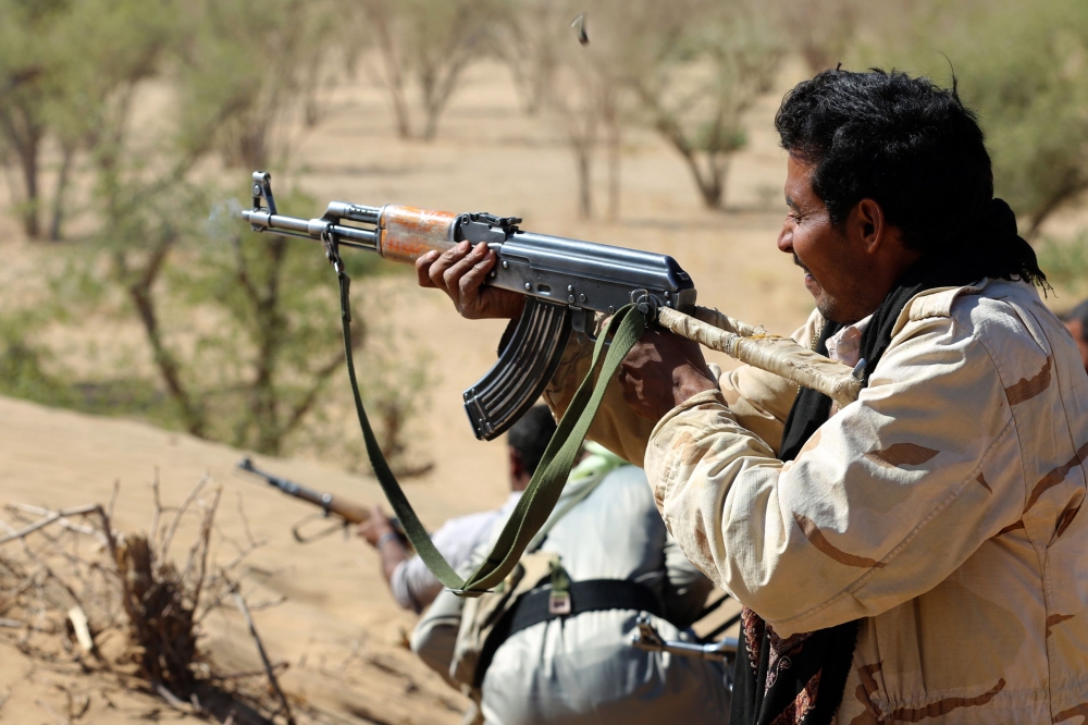 Yemeni tribesmen from the Popular Resistance Committees, supporting forces loyal to Yemen's President Abdrabbu Mansour Hadi, fire their weapons during clashes with Houthi rebels and their allies in Beihan, in the Shabwa province. Yemeni government forces retook Beihan district in Shabwa province from the Houthis, their last stronghold in the oil-rich southern province. — AFP