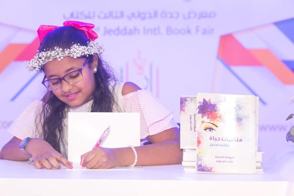 Youngest writer displays published work at book fair
