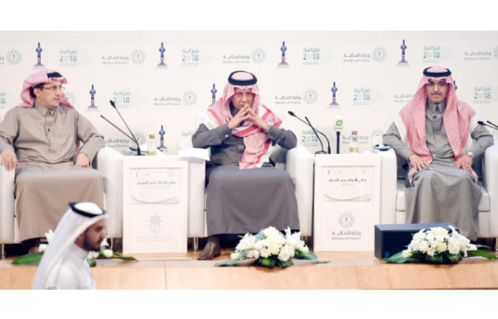 Saudi Finance Minister Mohammed Al-Jadaan (R), Minister of Economy and Planning Mohammed Al-Tuwaijri (C) and Saudi Arabian Monetary Authority (SAMA) Governor Ahmed Al-Khulaifi (L) take part in a press conference during which officials announced the salient features of state budget for 2018, in Riyadh on Tuesday. — AFP