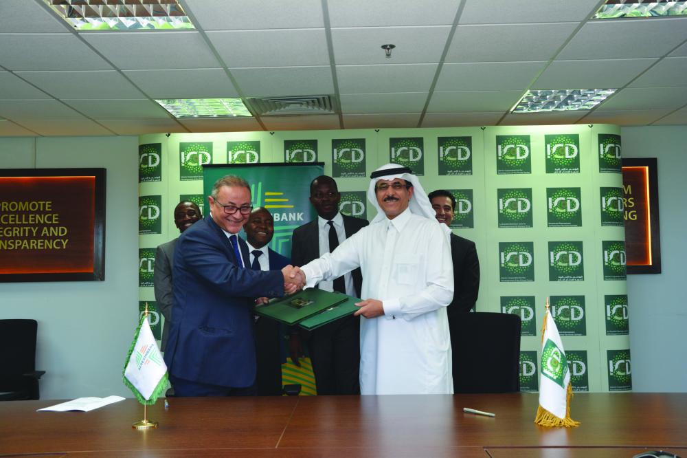 Amr Kamel, executive vice president at Afreximbank, left, shakes hands with Khaled Al-Aboodi, CEO, Islamic Corporation for the Development of the Private Sector in handshake during the signing ceremony in Jeddah. — Courtesy photo