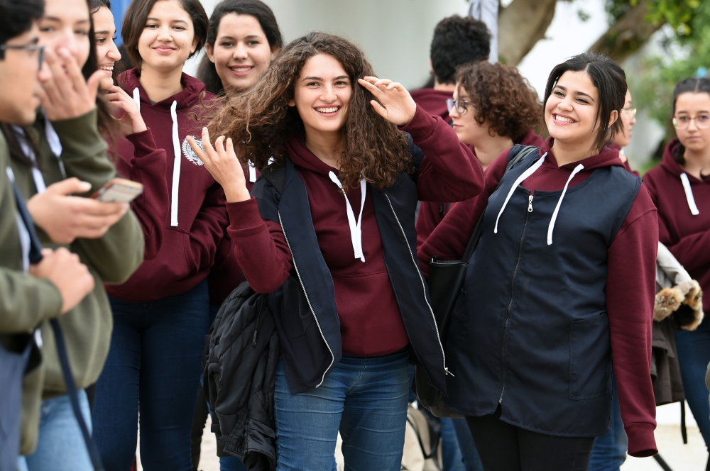 Siwar Tebourbi, center, an 18-year-old Tunisian schoolgirl, walks with her classmates as they leave school in Bizerte. In Tunisian high schools, the dress code is not uniform. Actually, it is: but only for girls. Boys can wear what they like, and now the girls are up in arms. One morning, instead of turning up for class wearing the regulation navy blue blouse, a defiant group of adolescent girls came to school in white t-shirts. - AFP