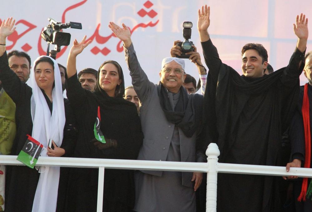 (R-L) Bilawal Bhutto Zardari, son of assassinated former prime minister Benazir Bhutto, waves alongside his father Asif Ali Zardari, and sisters Bakhtawar Bhutto Zardari and Aseefa Bhutto, during Benazir Bhutto's death anniversary in Garhi Khuda Bakhsh on December 27, 2017. — AFP