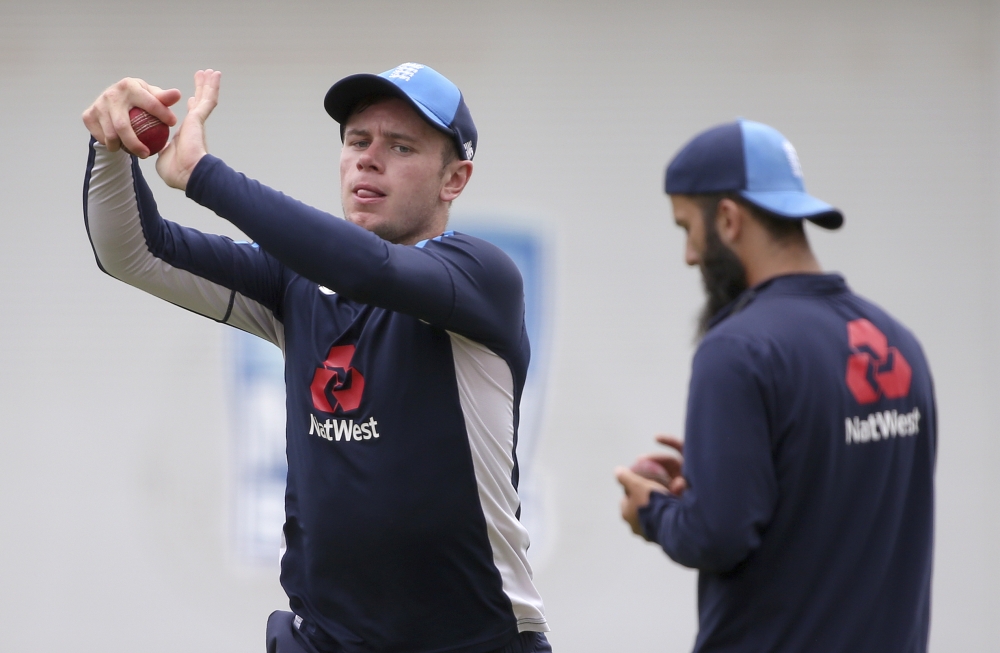 England's Mason Crane, left, bowls in the nets during training for their Ashes cricket Test match against Australia in Sydney, Wednesday. The Test begins on Thursday. — AP