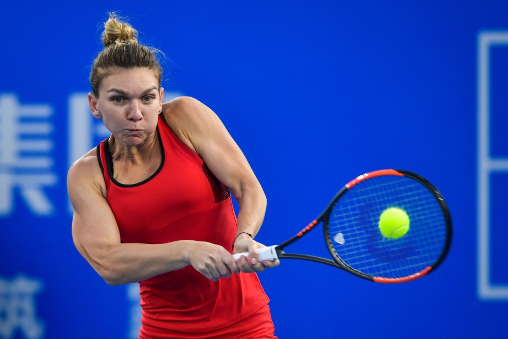 Simona Halep of Romania hits a return against Duan Yingying of China during their women's singles second round match at the WTA Shenzhen Open tennis tournament in Shenzhen in China's southern Guangdong province on Wednesday. — AFP
