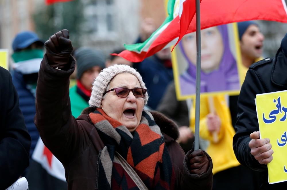

An opponent of Iranian President Hassan Rouhani chants slogans during a protest outside the European Union Council in Brussels, Belgium Wednesday. — Reuters