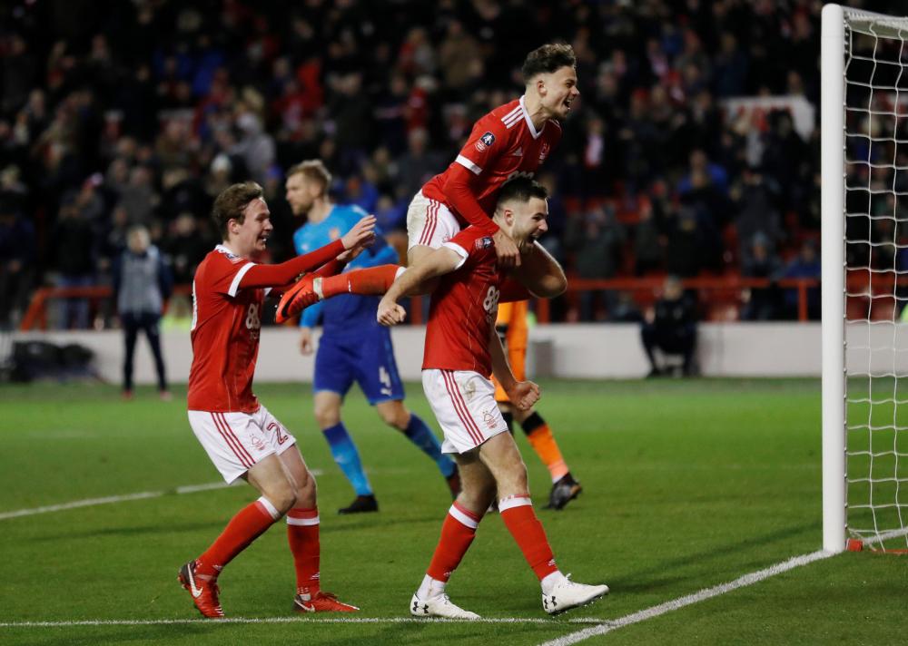 Nottingham Forest's Ben Brereton celebrates scoring their third goal against Arsenal with teammates during their FA Cup match at The City Ground, Nottingham, Sunday. — Reuters