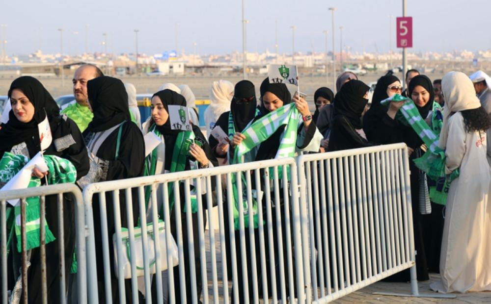 Saudi Women in scarves and hats cheer their clubs in Jeddah Stadium for the first time