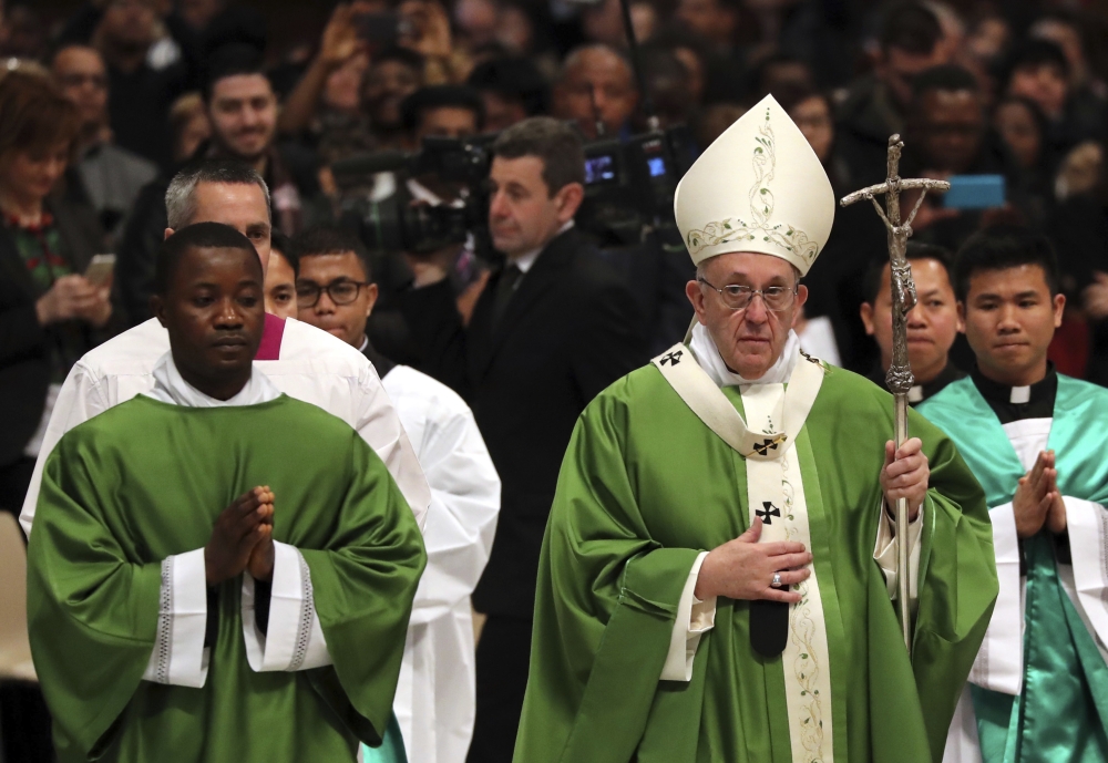 Pope Francis leaves after celebrating Mass at the Vatican, Sunday. Pope Francis says while fear of migrants is 