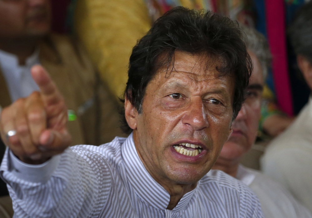 In this file photo, Pakistani opposition leader Imran Khan gestures during a news conference in Islamabad, Pakistan. Khan said Saturday that meeting US President Donald Trump would be a 