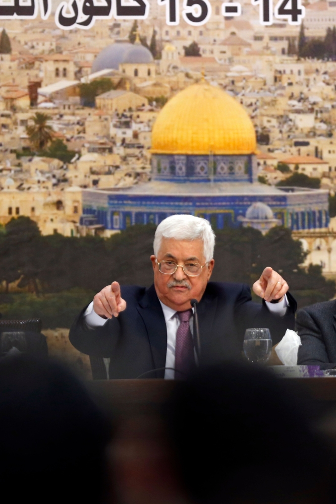 Palestinian President Mahmoud Abbas speaks during a meeting in the West Bank city of Ramallah on Sunday. — AFP