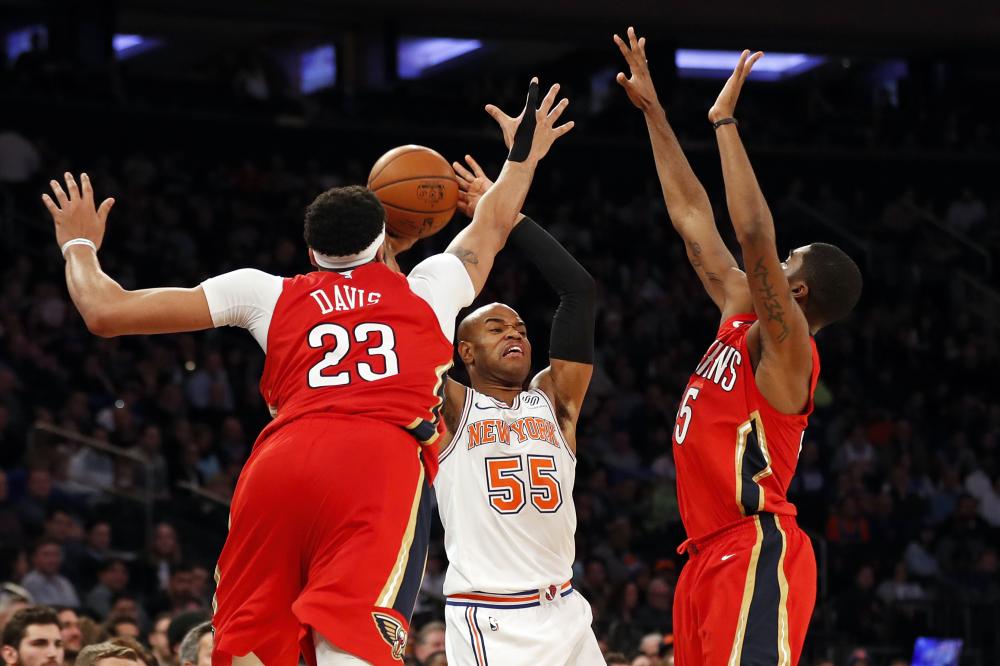 New York Knicks’ guard Jarrett Jack (C) looks to pass under pressure from New Orleans Pelicans’ forward Anthony Davis (L) and Pelicans’ guard Mike James during their NBA game at Madison Square Garden in New York Sunday. — Reuters