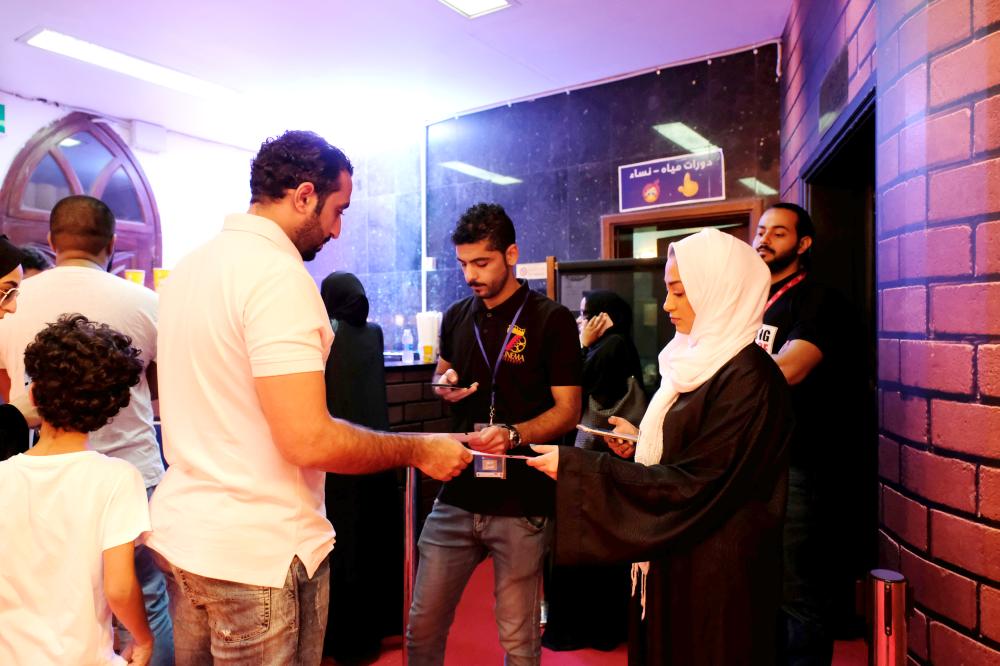 

People arrive to watch first cinema in Jeddah. — Reuters