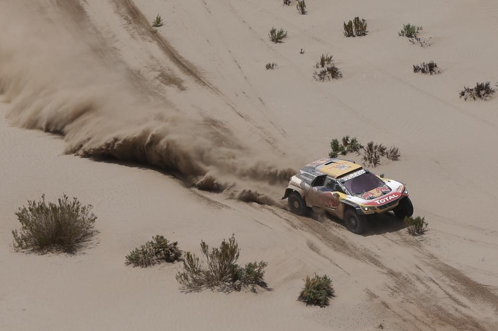Driver Stephane Peterhansel, of France, and co-driver Jean Paul Cottret, of France, race their Peugeot during stage 8 of the 2018 Dakar Rally between Uyuni and Tupiza, Bolivia, Sunday, Jan. 14, 2018. — AP