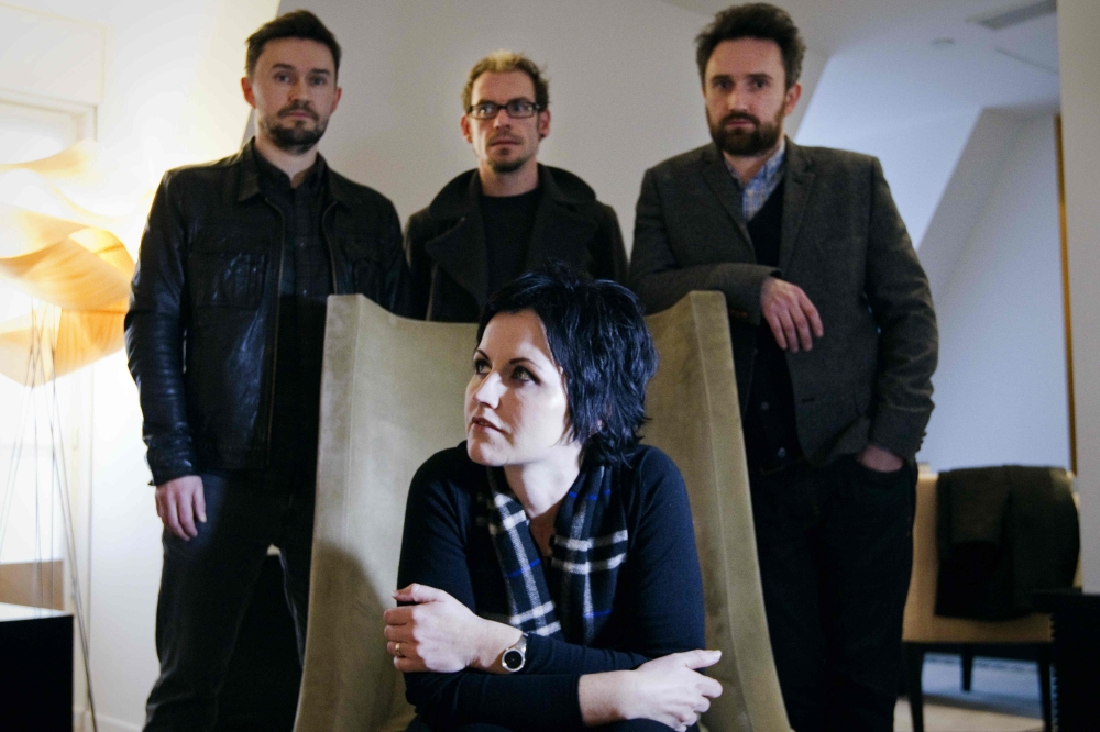 This file photo taken on Jan.18, 2012, shows the members of the Irish rock band The Cranberries, singer Dolores O'Riordan (sitting), bassist Mike Hogan, left, drummer Fergal Lawler, center and guitar player Noel Hogan. - AFP