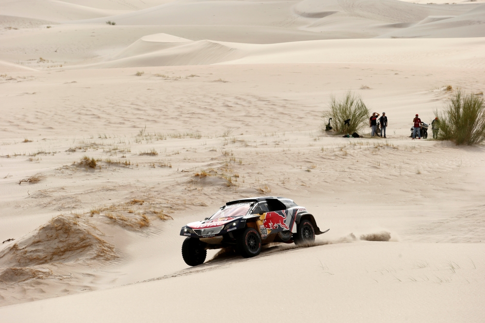 Carlos Sainz of Spain and copilot Lucas Cruz of Spain drive their Peugeot from Belen to Chilecito in the 40th Dakar Edition stage eleven. — Reuters