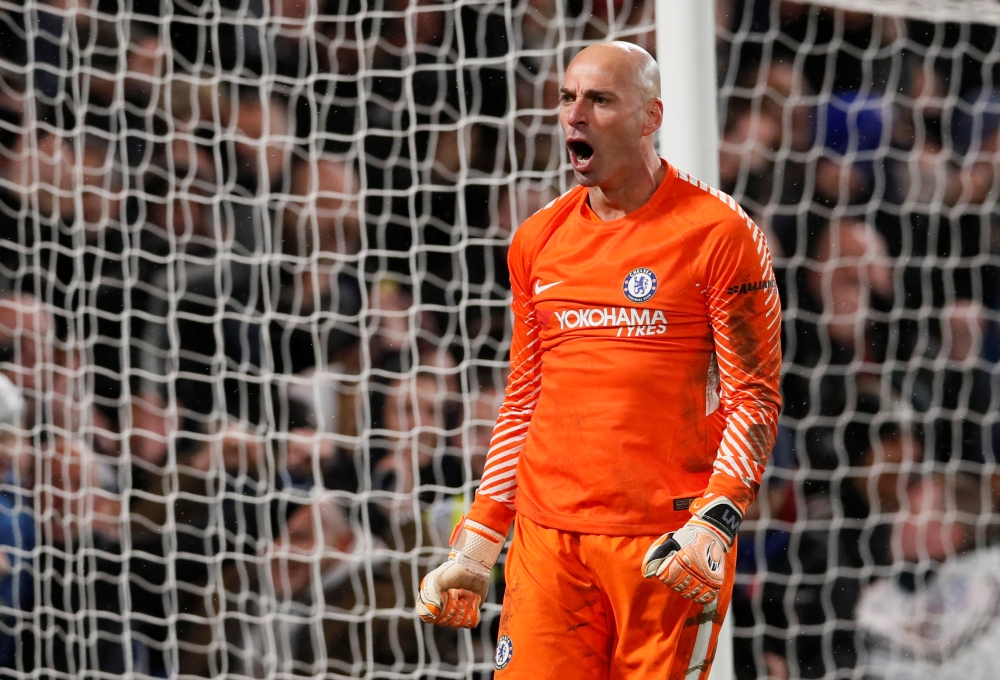 Chelsea's Willy Caballero celebrates saving a penalty from Norwich City's Nelson Oliveira during the penalty shoot out in Wednesday's FA Cup third round replay in London. — Reuters