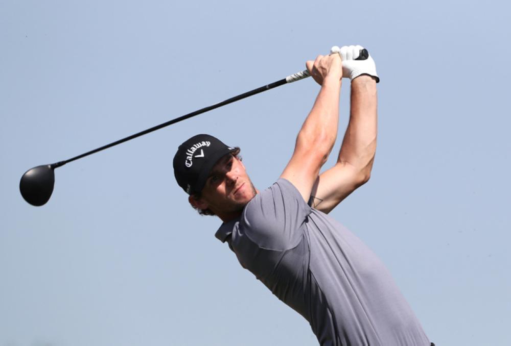 Belgium's Thomas Pieters plays a shot during the Abu Dhabi HSBC Golf Championship Saturday. — Reuters