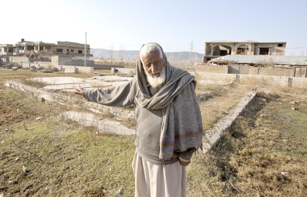 Zain Muhammad, a former watchman for Osama Bin Laden talks about him at the remains of Bin Laden's house, in Abbottabad, Pakistan.  