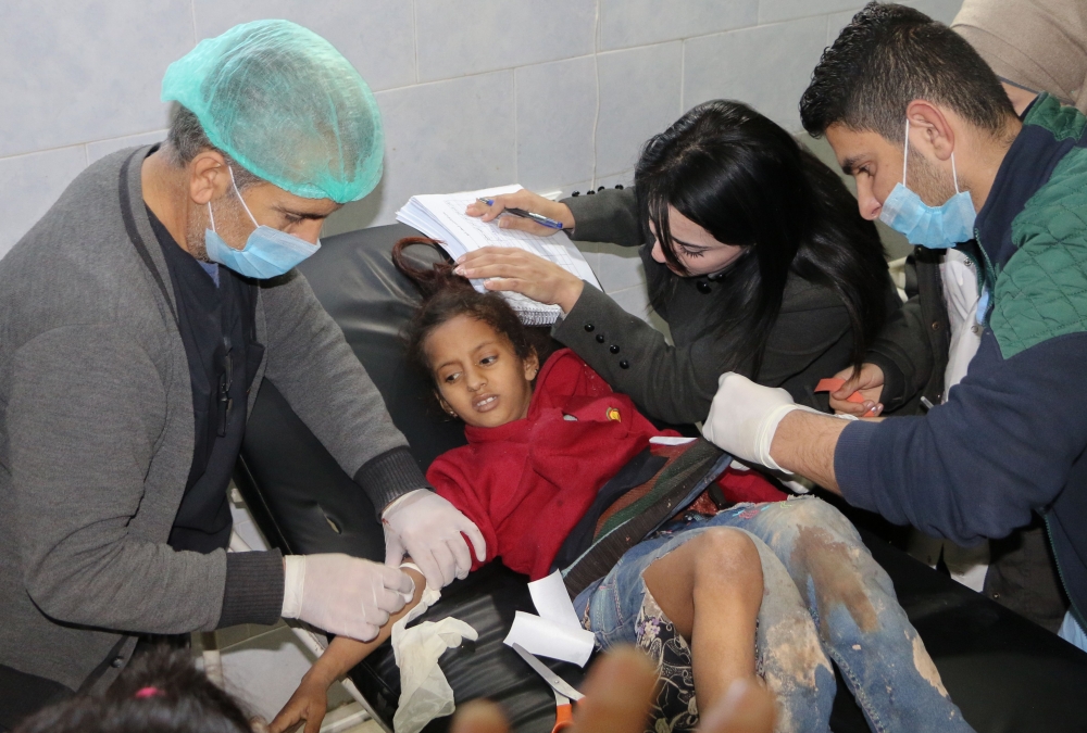 An injured girl receives treatment at the Avrin hospital in the Kurdish-majority town of Afrin in northern Syria. — AFP