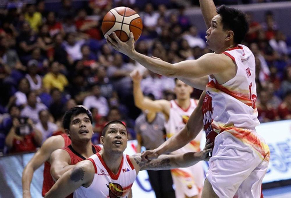 ﻿﻿﻿Phoenix's Jeff Chan lays up as teammate Willie Wilson boxes out Ginebra's Jervy Cruz in the PBA Philippine Cup game between the Fuel Masters and the Kings on Friday night at the Smart-Araneta Coliseum.