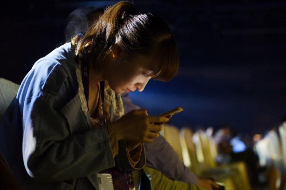 One in four mobile phone gamers in China is a woman, and the numbers are expected to grow. - AFP