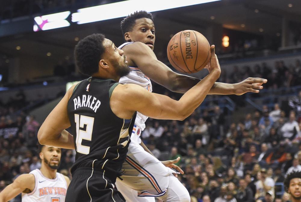 Milwaukee Bucks’ forward Jabari Parker (L) takes a shot while New York Knicks’ guard Frank Ntilikina (11) defends during their NBA game at the BMO Harris Bradley Center in Milwaukee Friday. — Reuters