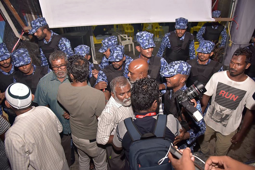 Maldives police forcibly enter the main opposition Maldivian Democratic Party (MDP) camp to break up celebrations of opposition supporters gathered to celebrate the Supreme Court’s decision to order the release of all jailed political leaders near the capital Male on Friday. — AFP