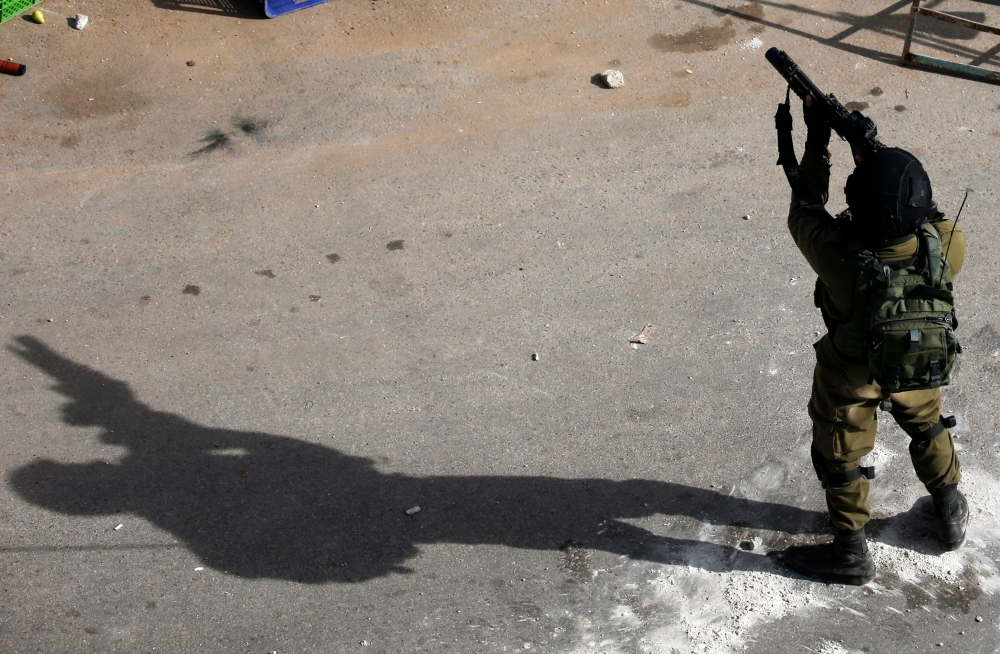 An Israeli soldier patrols on Saturday in the West Bank village of Zababdeh, north of Jenin, during a search operation for Palestinians suspected of carrying out attacks. — AFP