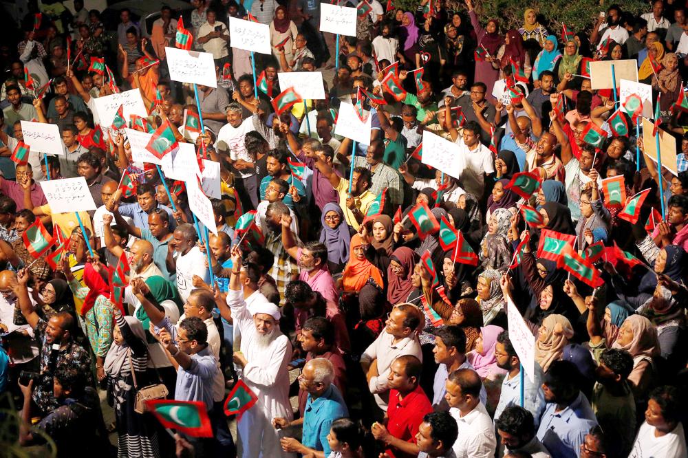 Opposition supporters protest against the government’s delay in releasing their jailed leaders, including former President Mohamed Nasheed, despite a Supreme Court order, in Male, on Sunday. — Reuters