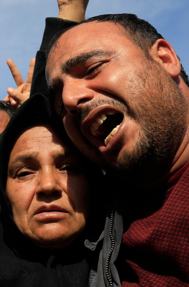 A picture taken on Saturday in the town of Afrin shows the mother (3rd-L), sister (2nd-L) and brother (C) of the late 23-year-old YPJ fighter Barin Kobani, chanting slogans during a mourning ceremony in her honor, after the YPJ and the Syrian Observatory for Human Rights accused Turkish-backed Syrian rebels of filming her mutilated dead body. — AFP