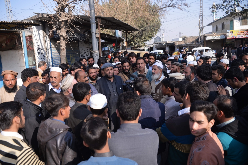 Pakistani relatives of suspects accused in a blasphemy lynching case speak outside the central jail after an anti-terrorist court’s verdict in Haripur district on Wednesday. — AFP