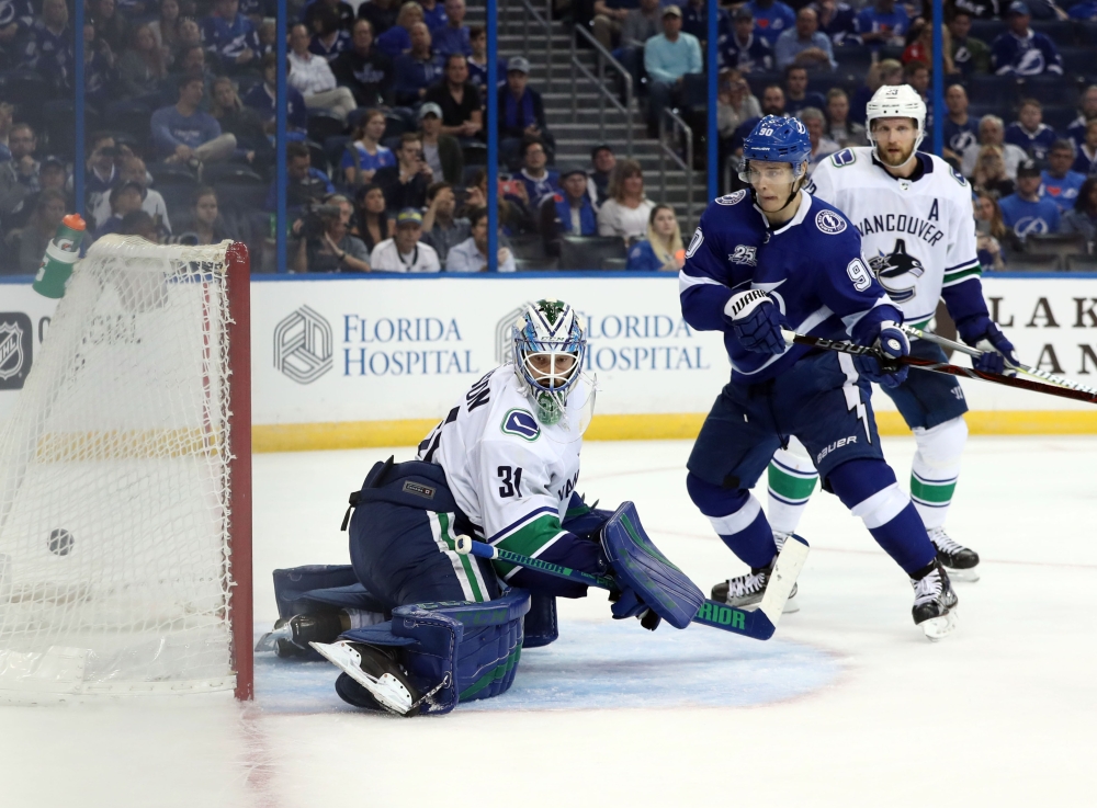 Tampa Bay Lightning center Vladislav Namestnikov (90) scores on Vancouver Canucks goaltender Anders Nilsson (31) during the third period at Amalie Arena. — Reuters