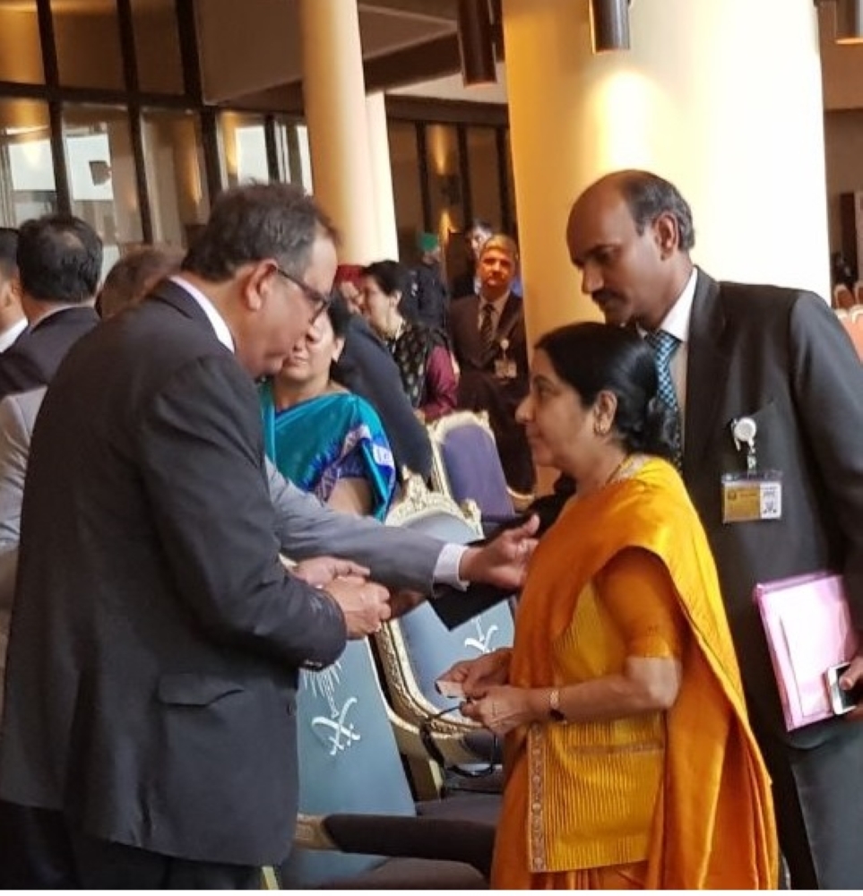 D. K. Sen, whole time director & senior executive vice president (infrastructure), Larsen & Toubro receives Indian External Affairs Minister Sushma Swaraj during the festival in Riyadh on Wednesday. — Courtesy photo